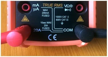 Multimeter probes set to measure current